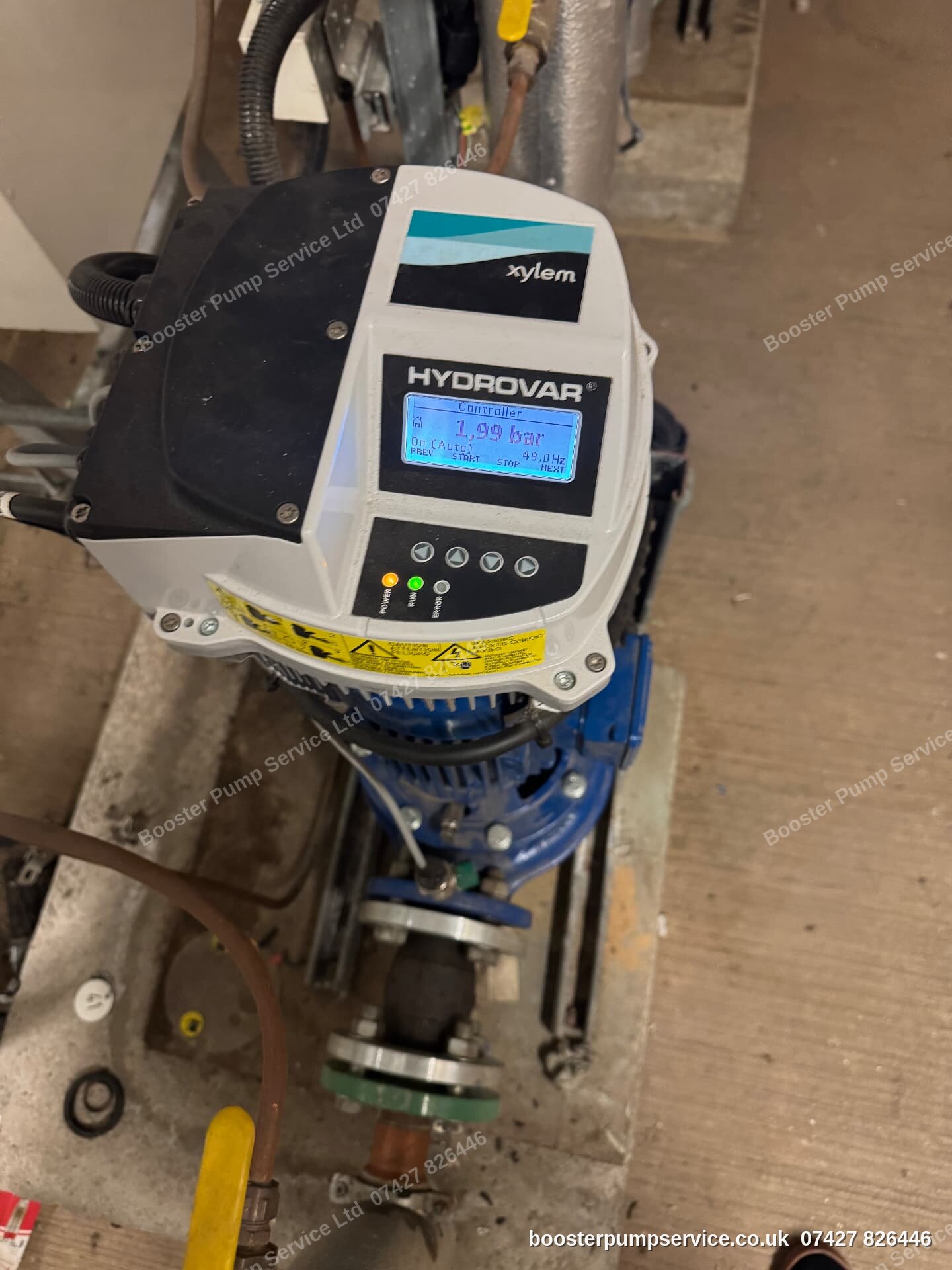 Xylem Hydrovar variable speed drive running at 1.99 bar on a booster pump — pump commissioning by our engineers in London.